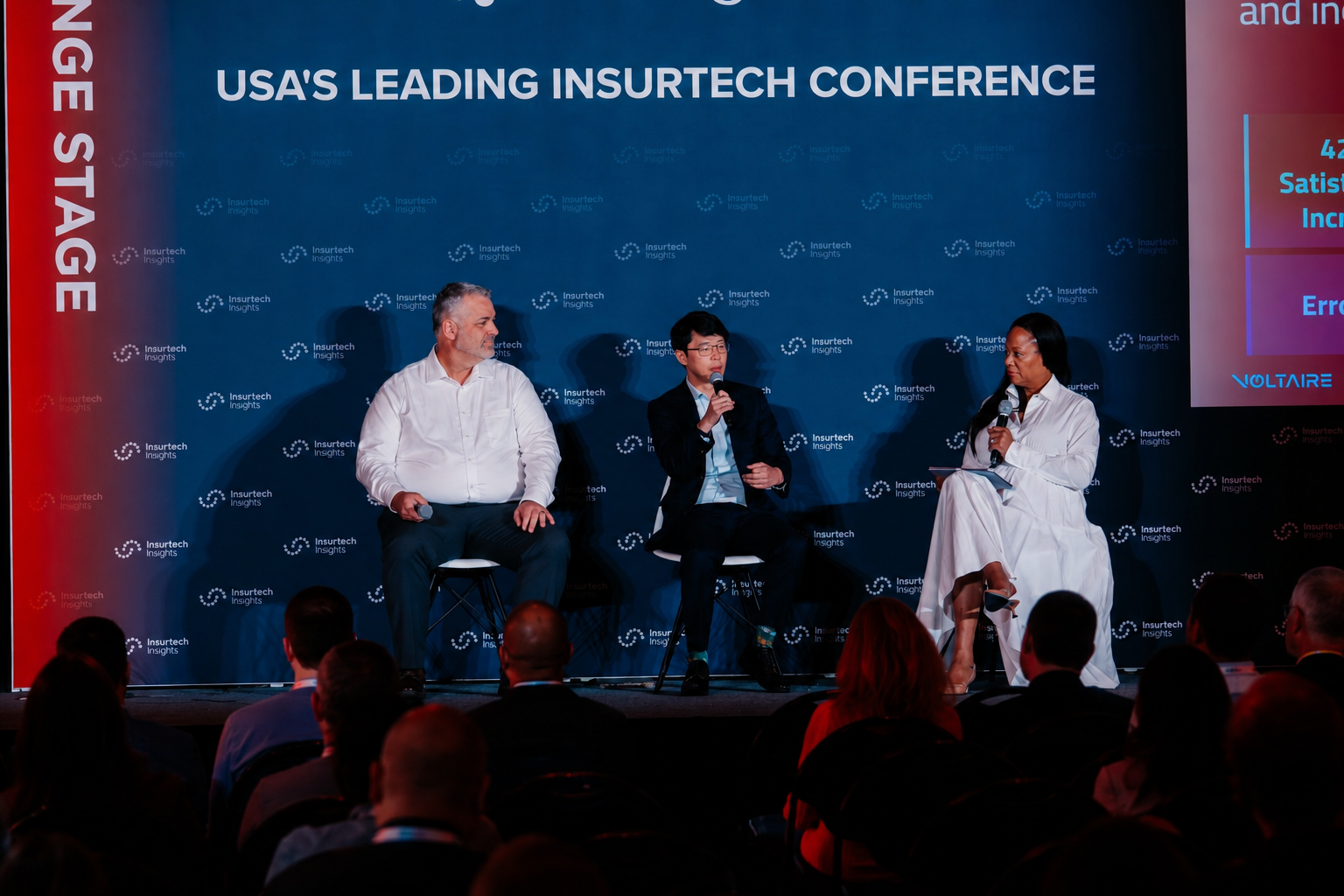 Insurance claims leaders discussing practical AI adoption on stage
