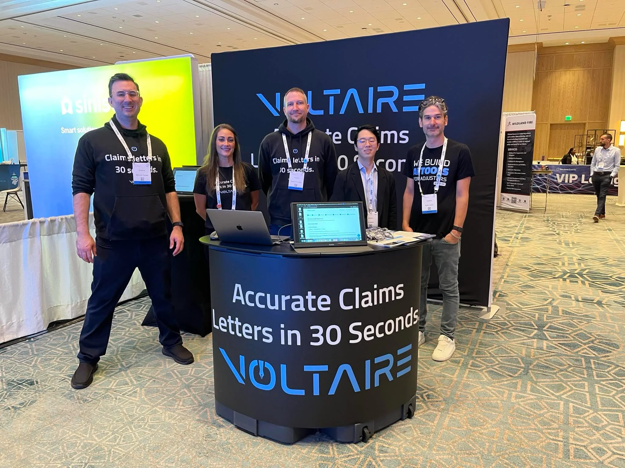 Voltaire team members at a PLRB Innovation booth