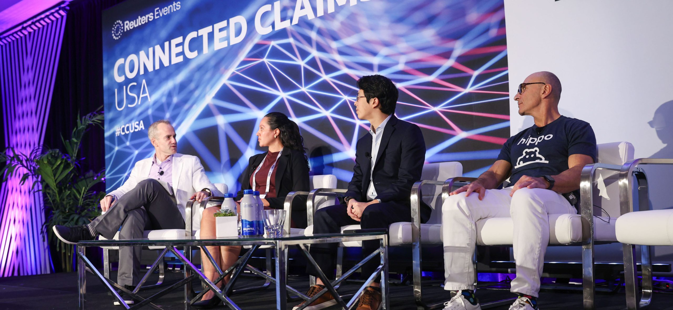 Connected Claims conference panel with Voltaire represented on stage