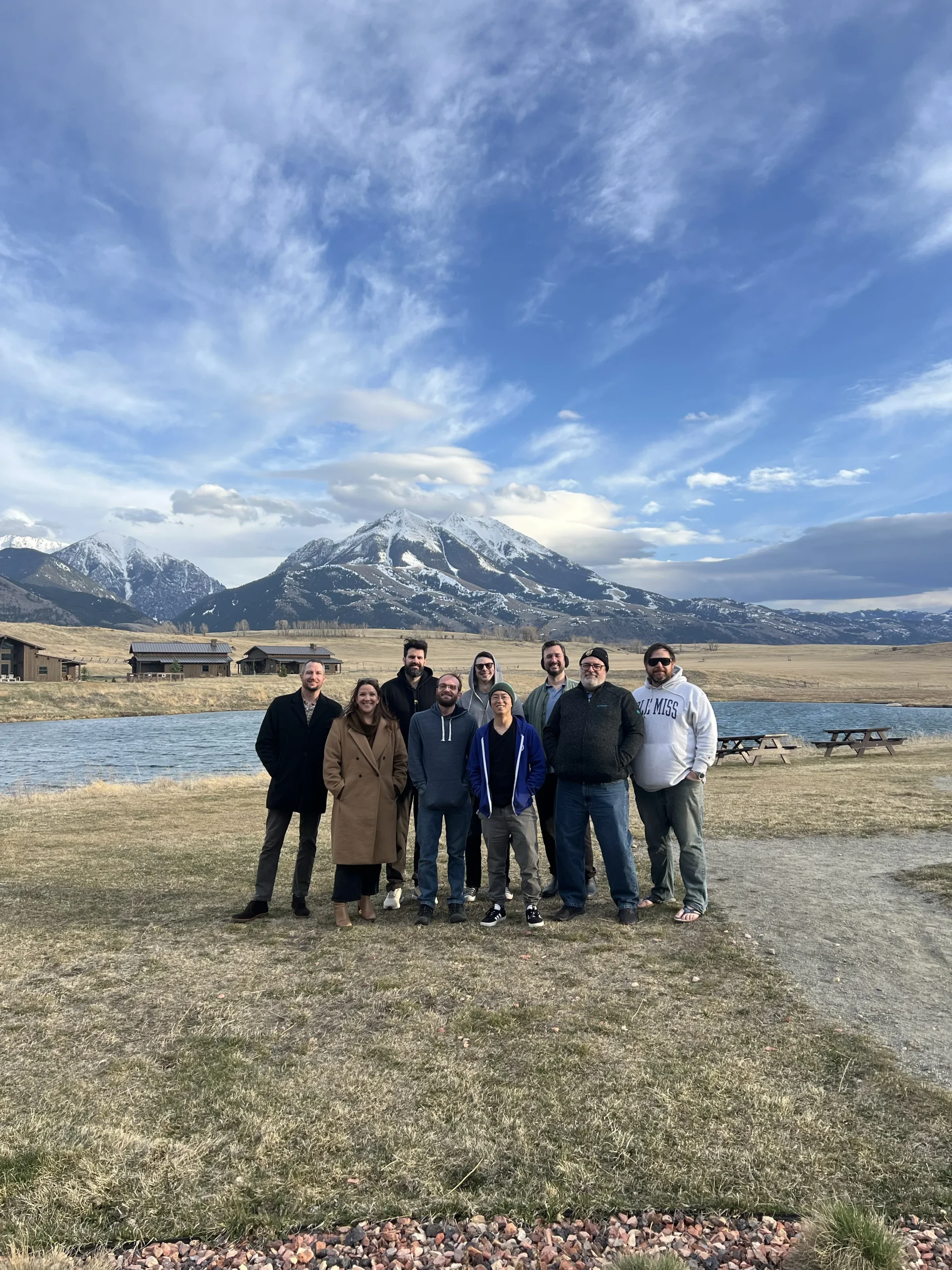 Voltaire team group photo with a large mountain background